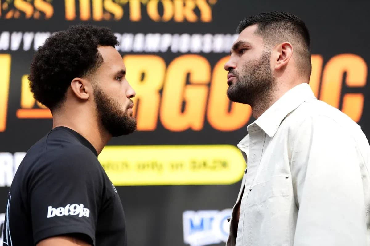 Two boxers facing off at promotional event
