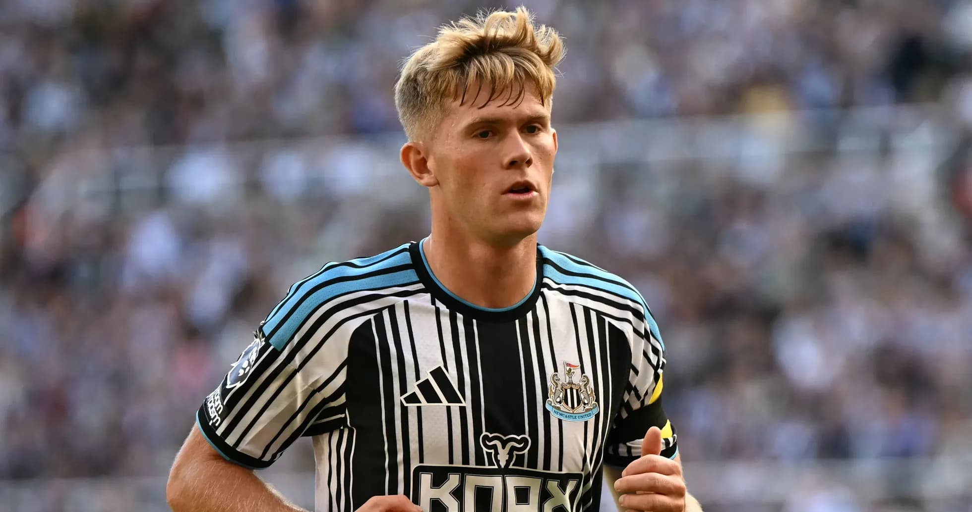 Newcastle player running on the pitch during match