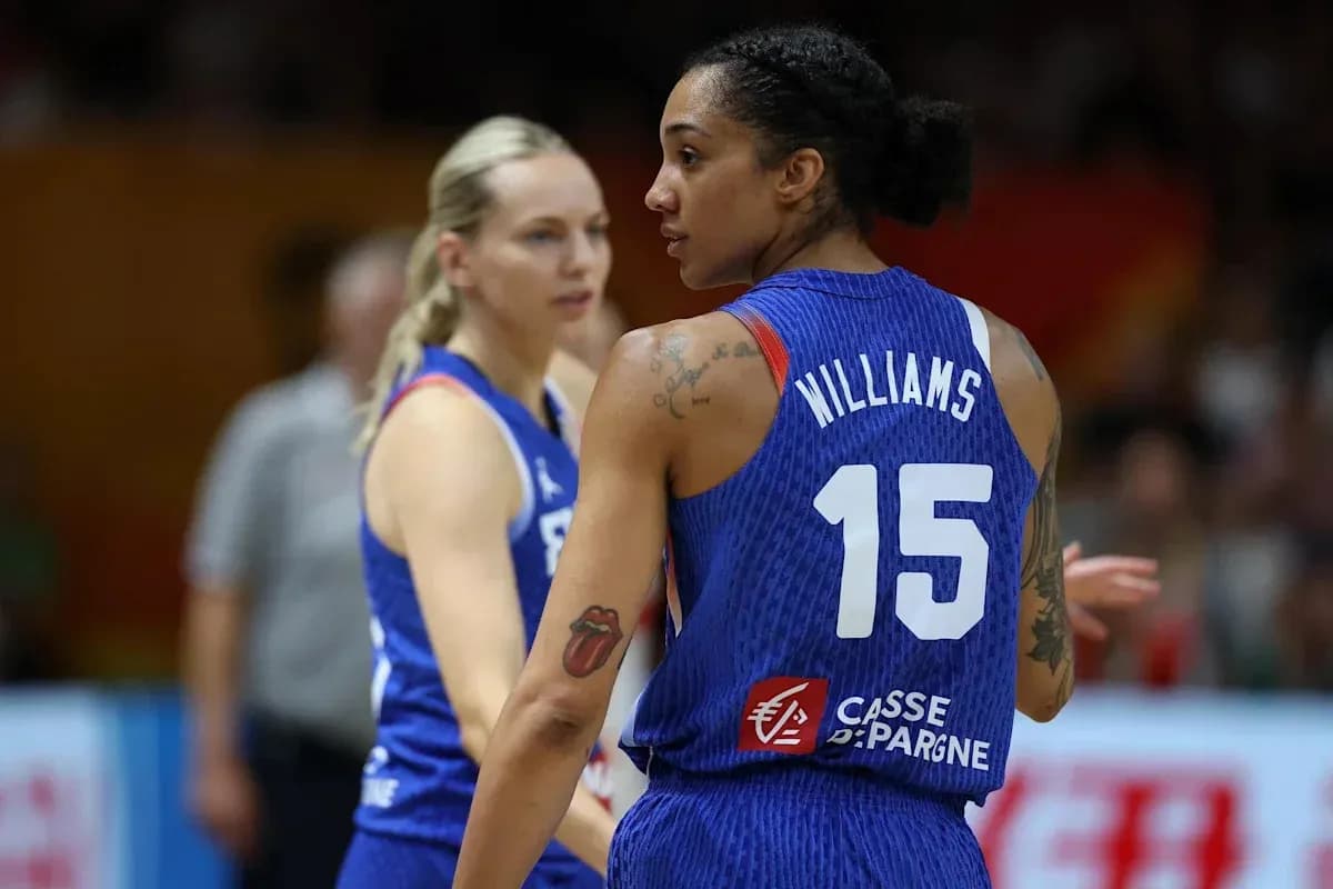 Two basketball players on the court during game