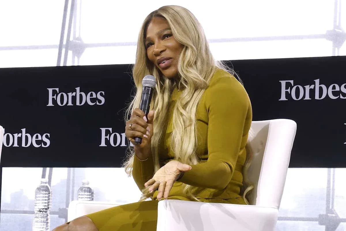 Speaker discussing at Forbes event with microphone