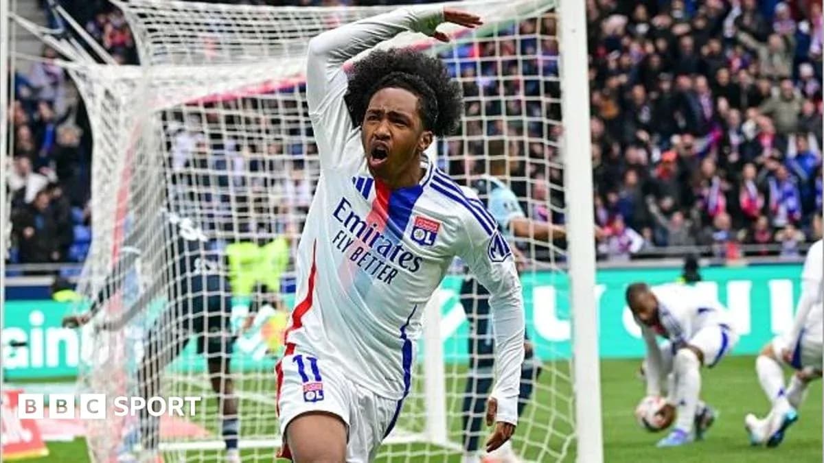 Player celebrating after scoring a goal for Lyon