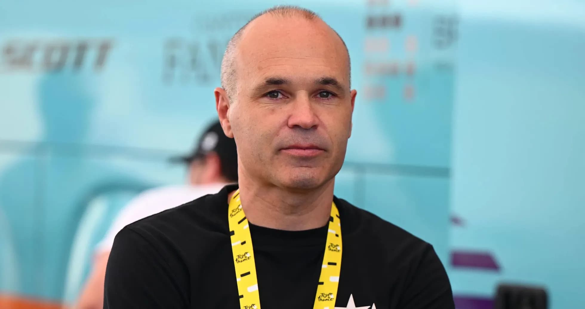 Person with a yellow lanyard in a sports setting