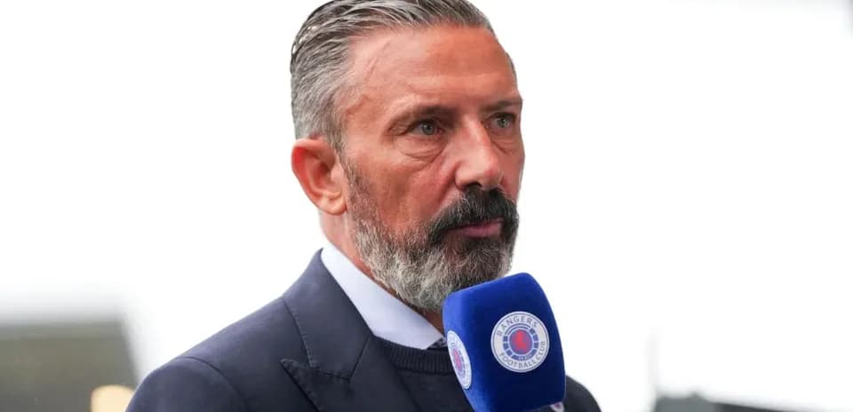 Man speaking into microphone during interview