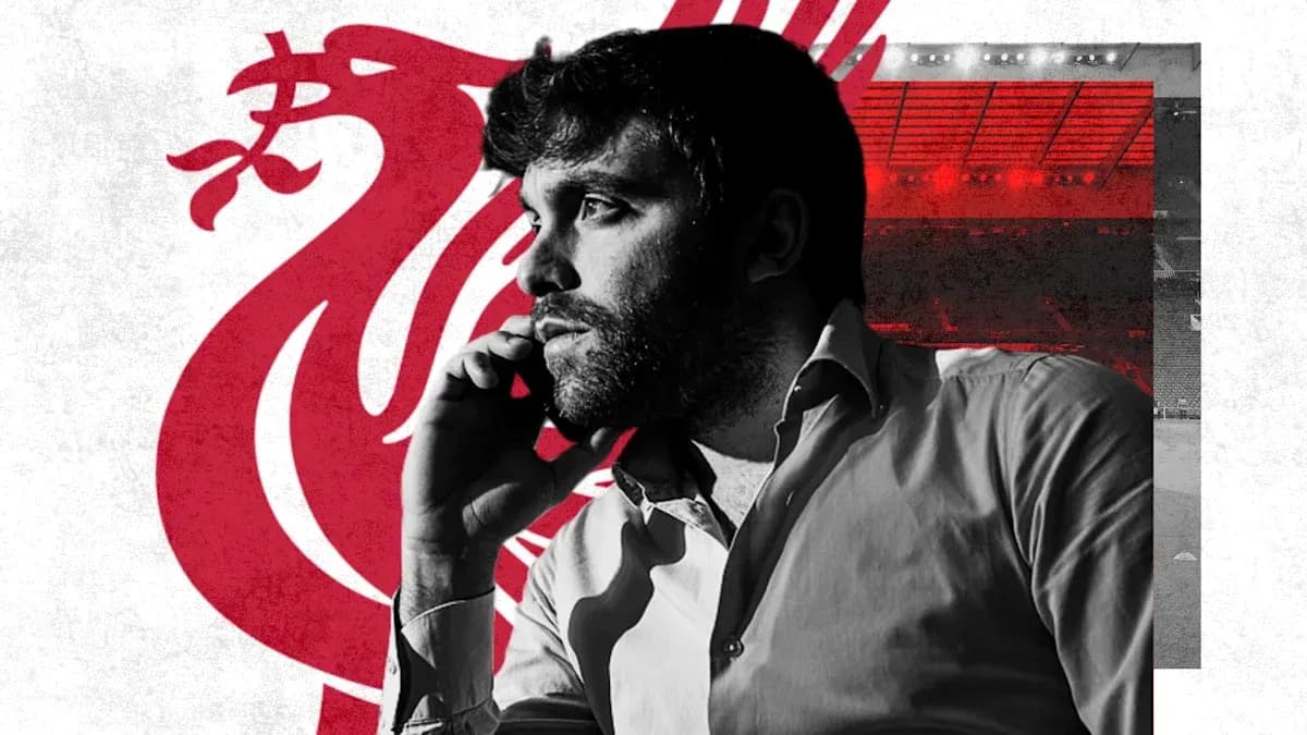 Man on phone with Liverpool FC logo background