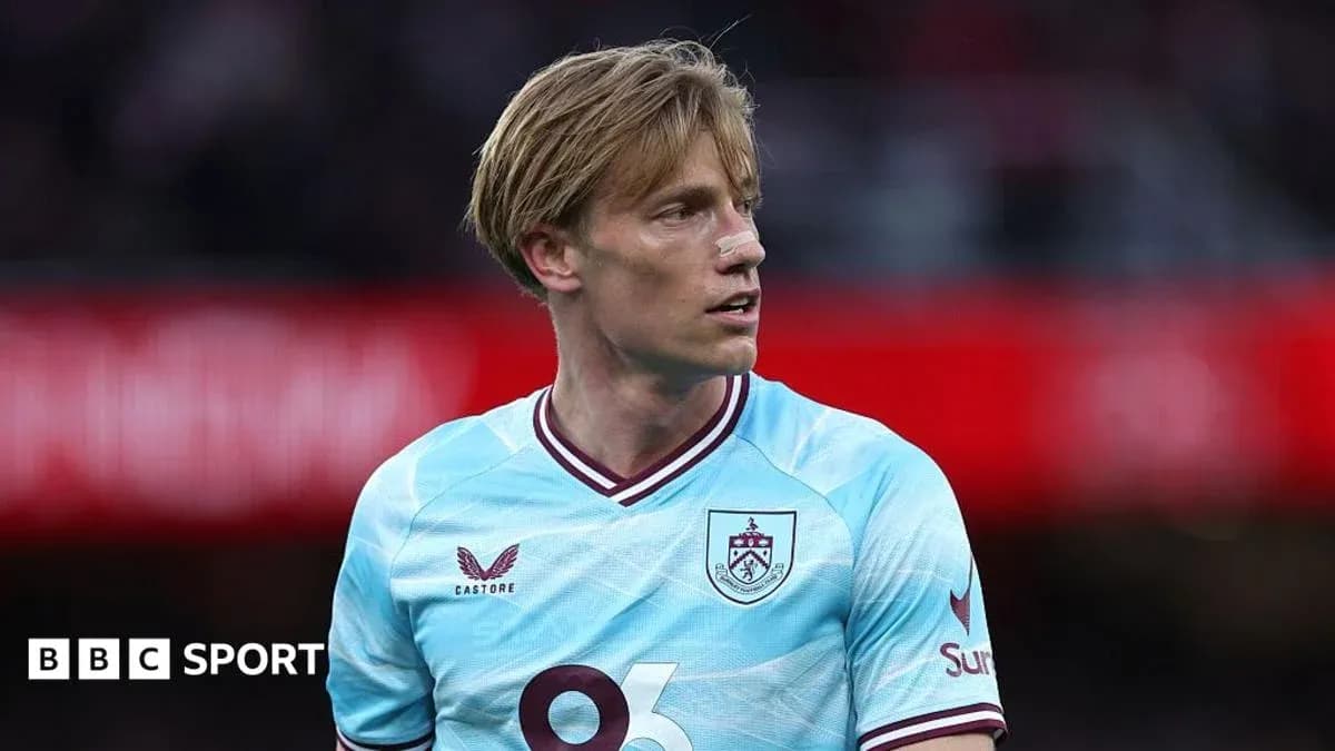 Player in light blue Burnley jersey during match