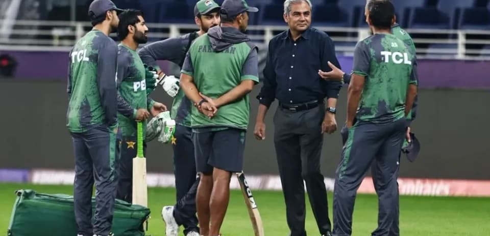 Pakistan cricket team discussing strategy on field