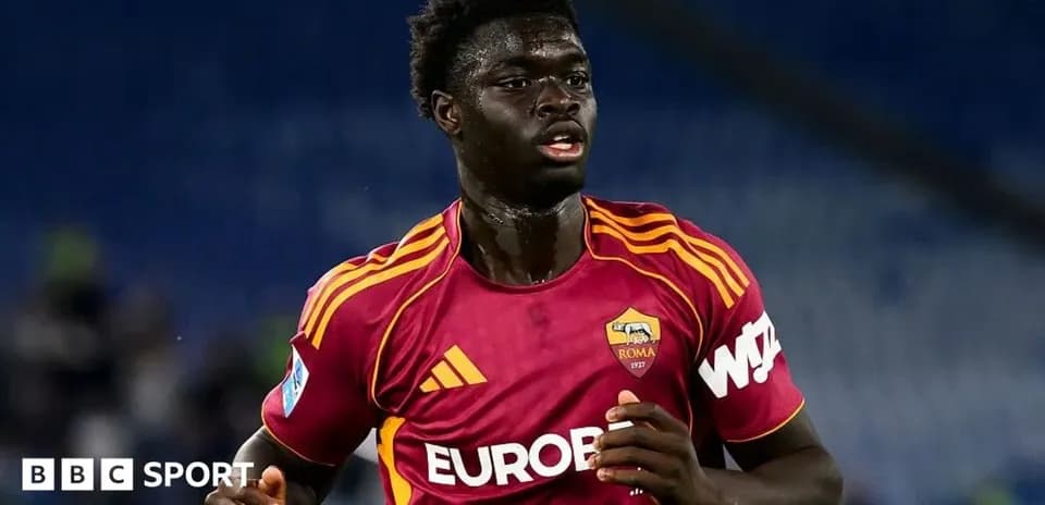 Player in AS Roma jersey running on the field