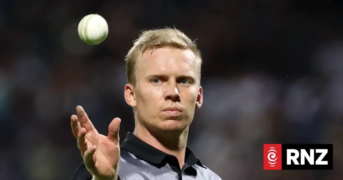 Cricket player throwing ball during match