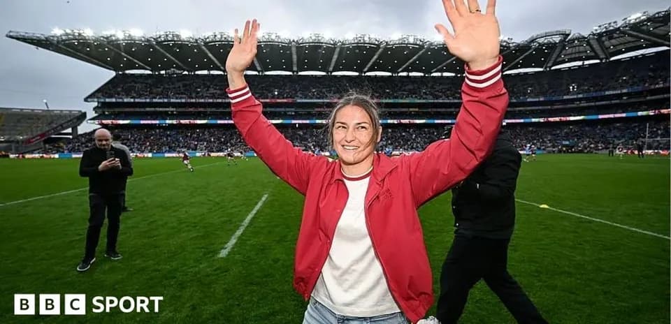 Person celebrating on the field at a stadium