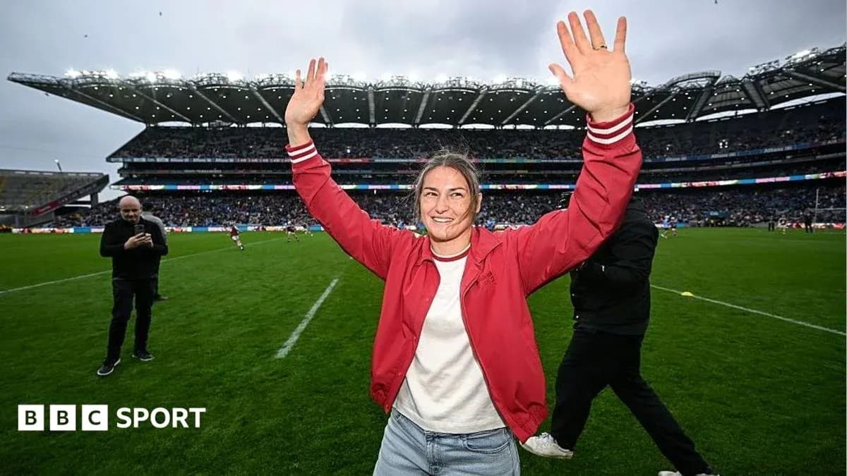 Person celebrating on the field at a stadium
