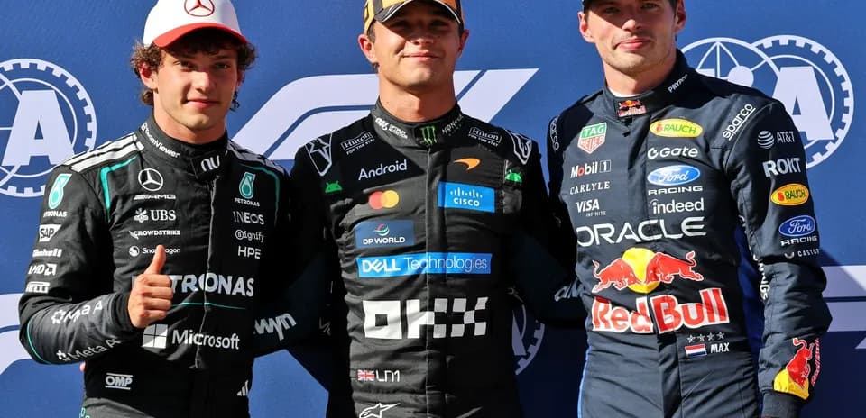 Three Formula 1 drivers posing together after race