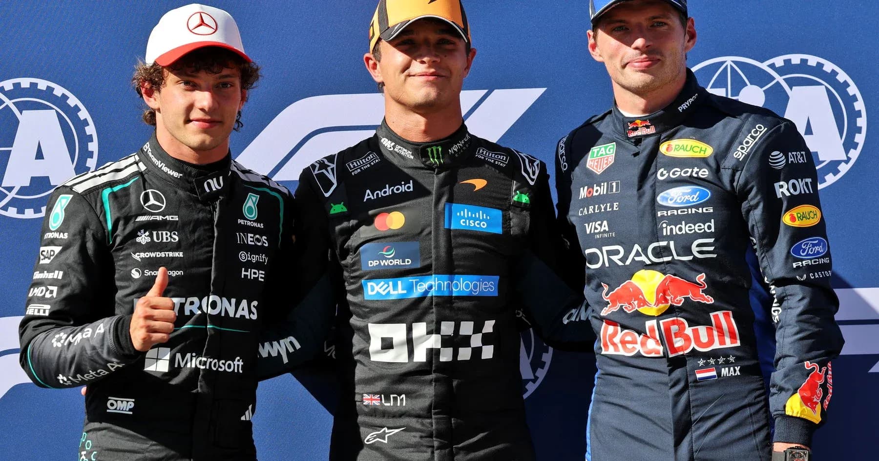 Three Formula 1 drivers posing together after race