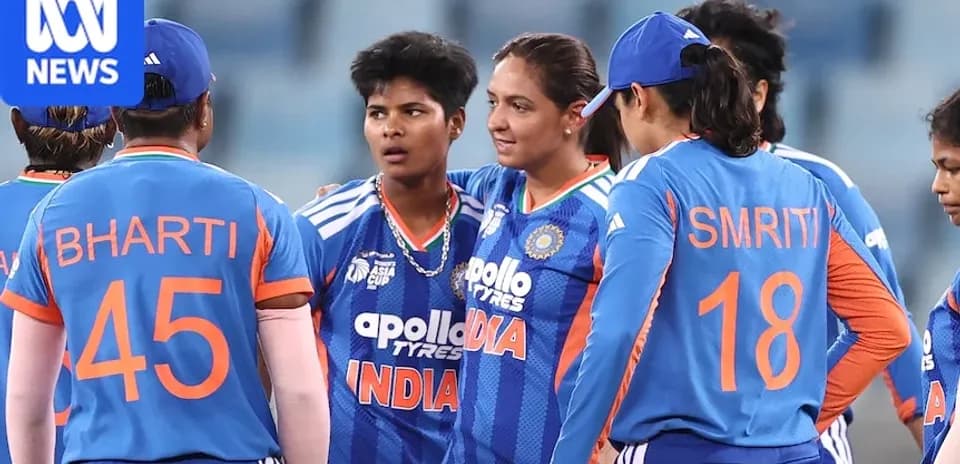 Indian women's cricket team discussing strategy on field