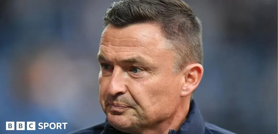 Coach looking thoughtful during a match