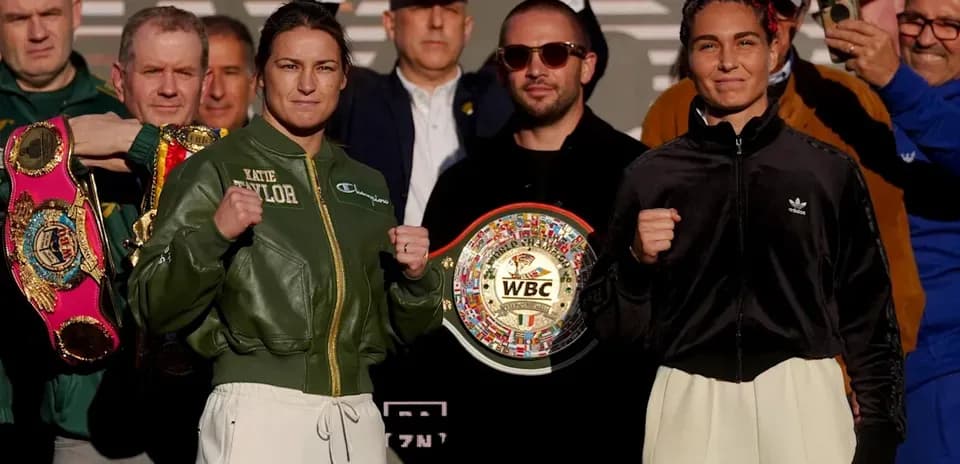 Katie Taylor and opponent posing before boxing match