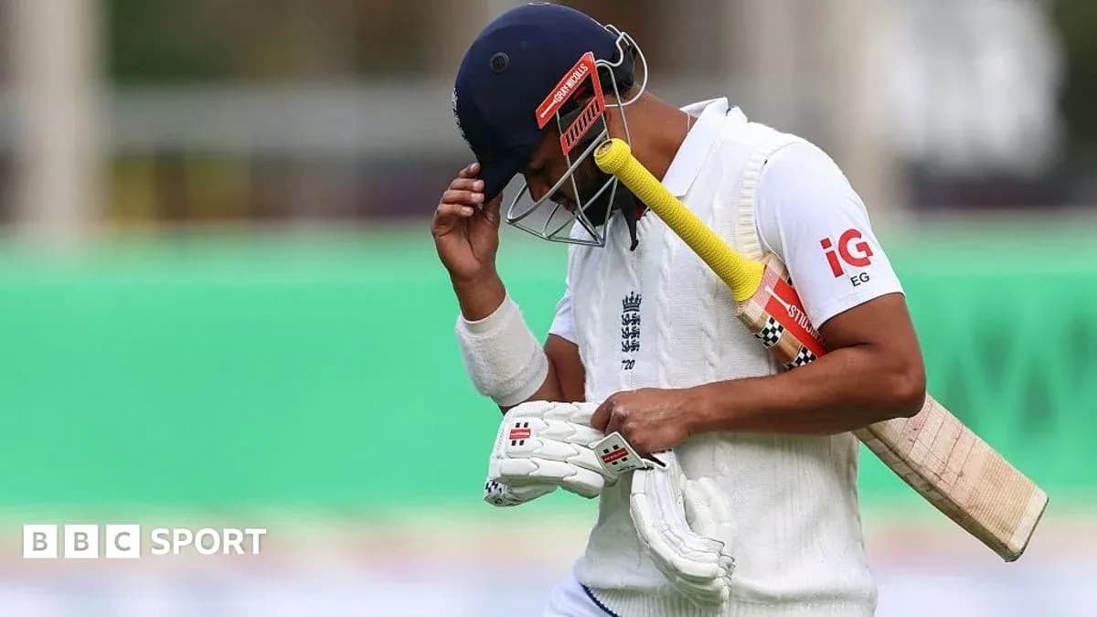 Cricketer walking off field after dismissal