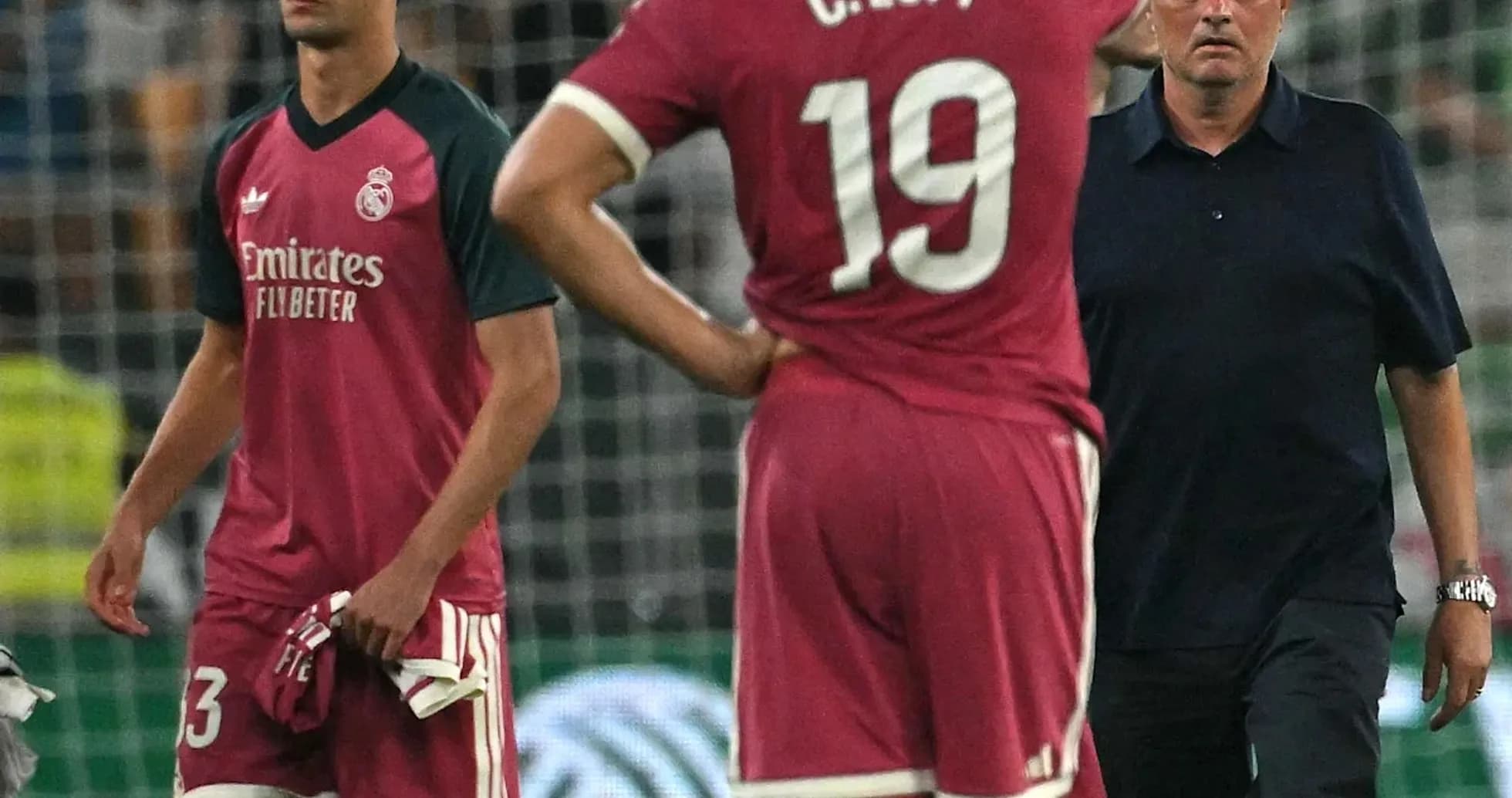 Players and coach discussing after a match