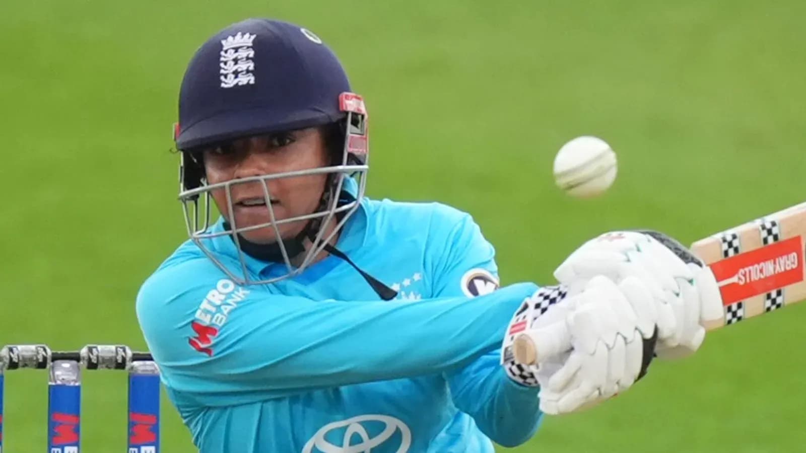 Batter hitting the ball during cricket match