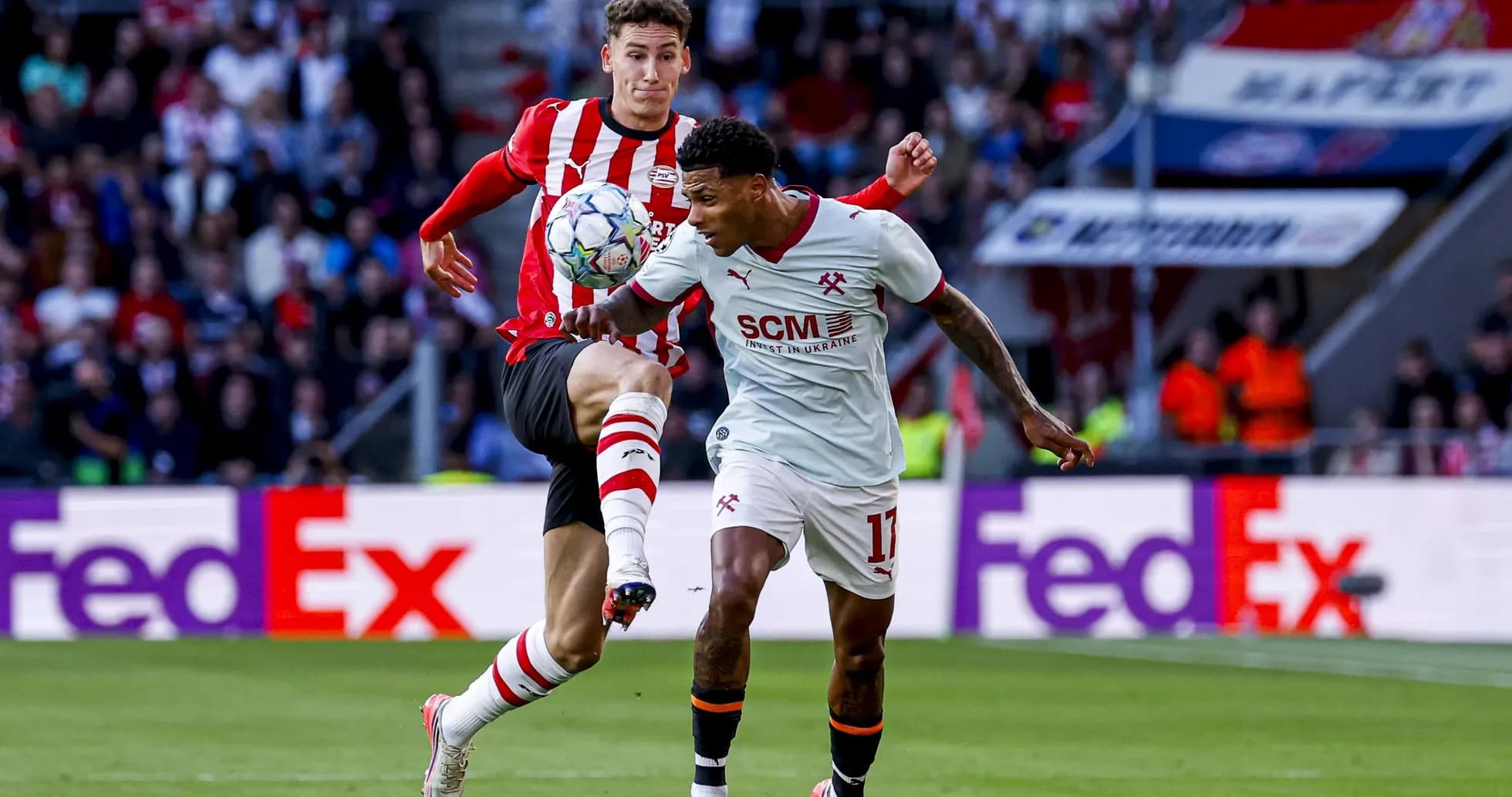 Two players competing for the ball during match