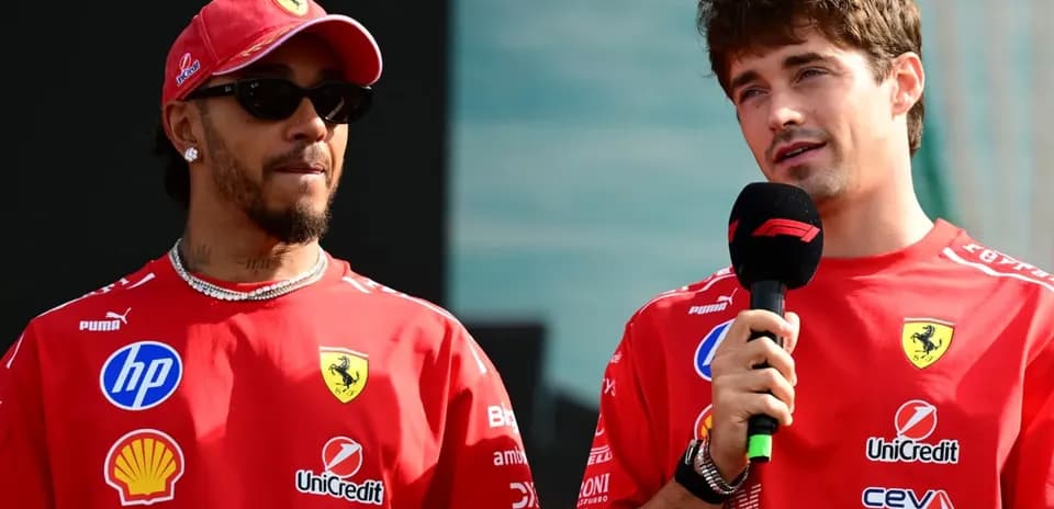 Two drivers in Ferrari shirts speaking at event