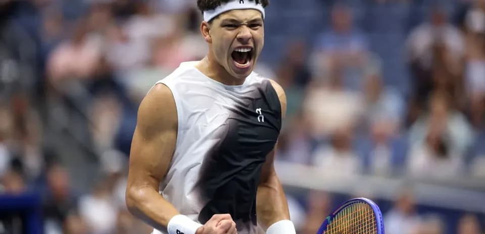 Tennis player celebrating a point during match