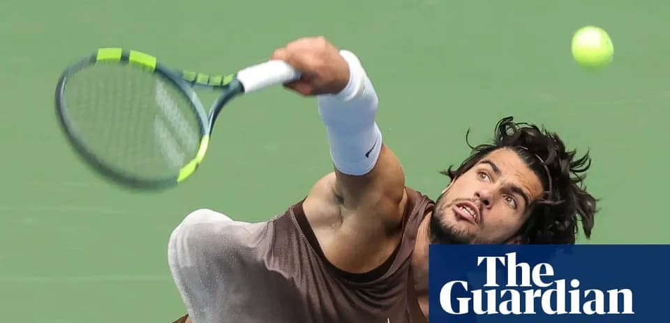 Player serving during a tennis match on court