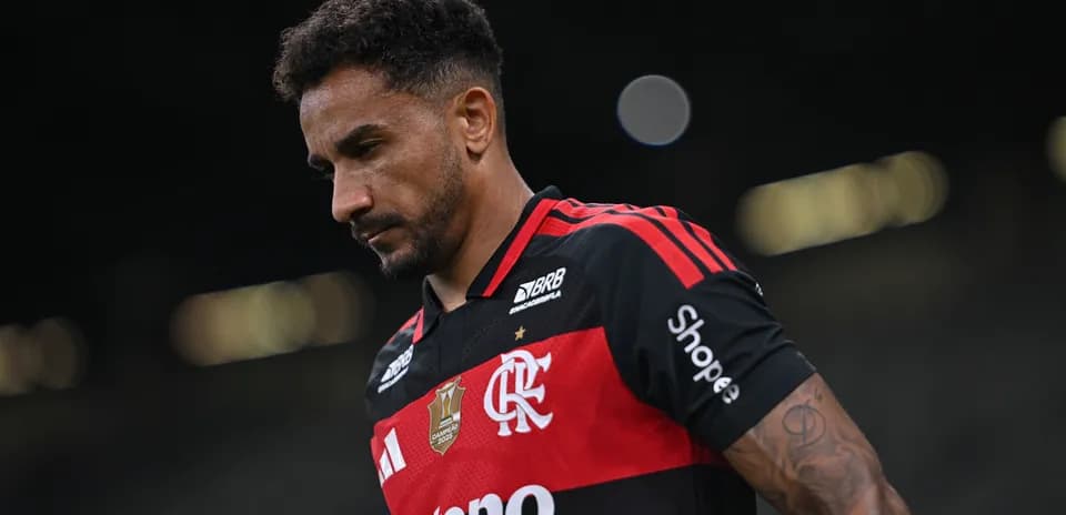 Player wearing Flamengo jersey walking on the field