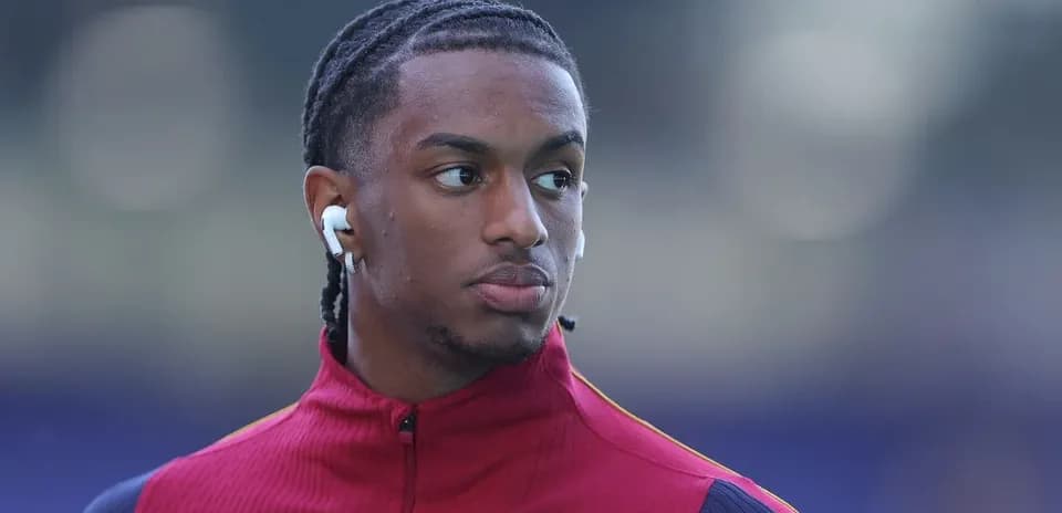 Player wearing earbuds during warm-up session
