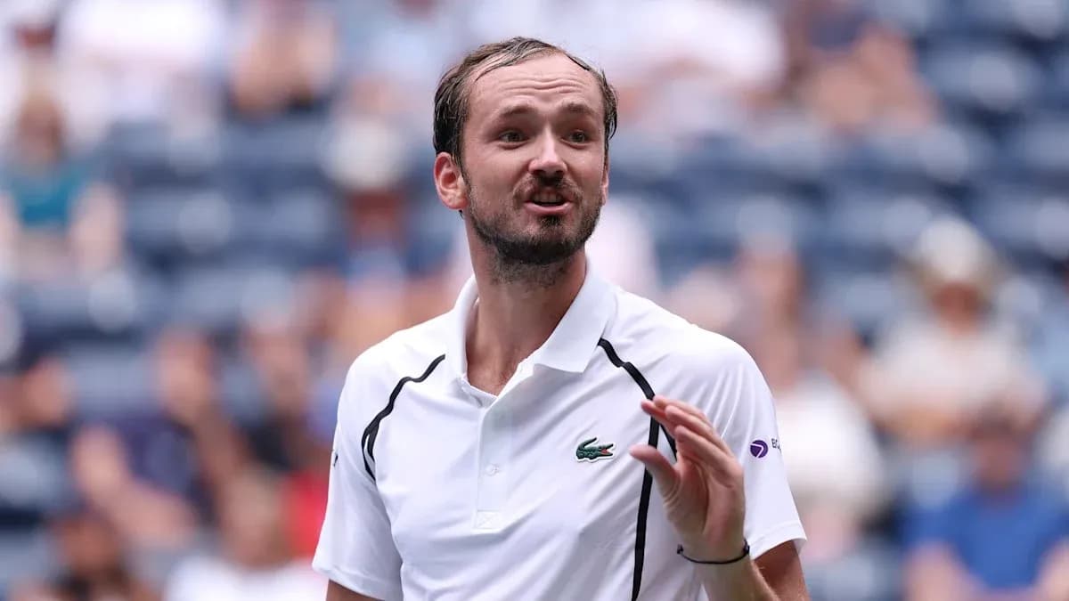 Tennis player gesturing during match on court Tennis player gesturing during match on court