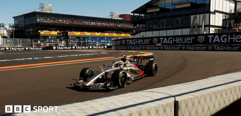 Formula 1 car racing on track near grandstand