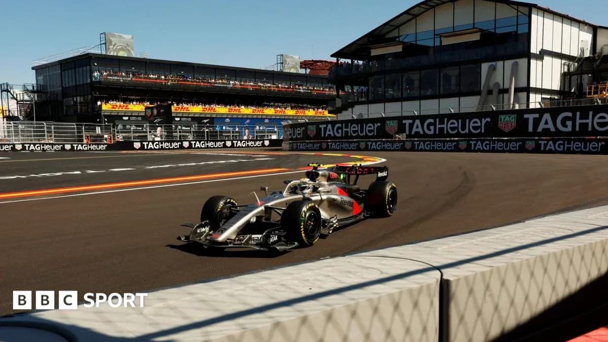 Formula 1 car racing on track near grandstand