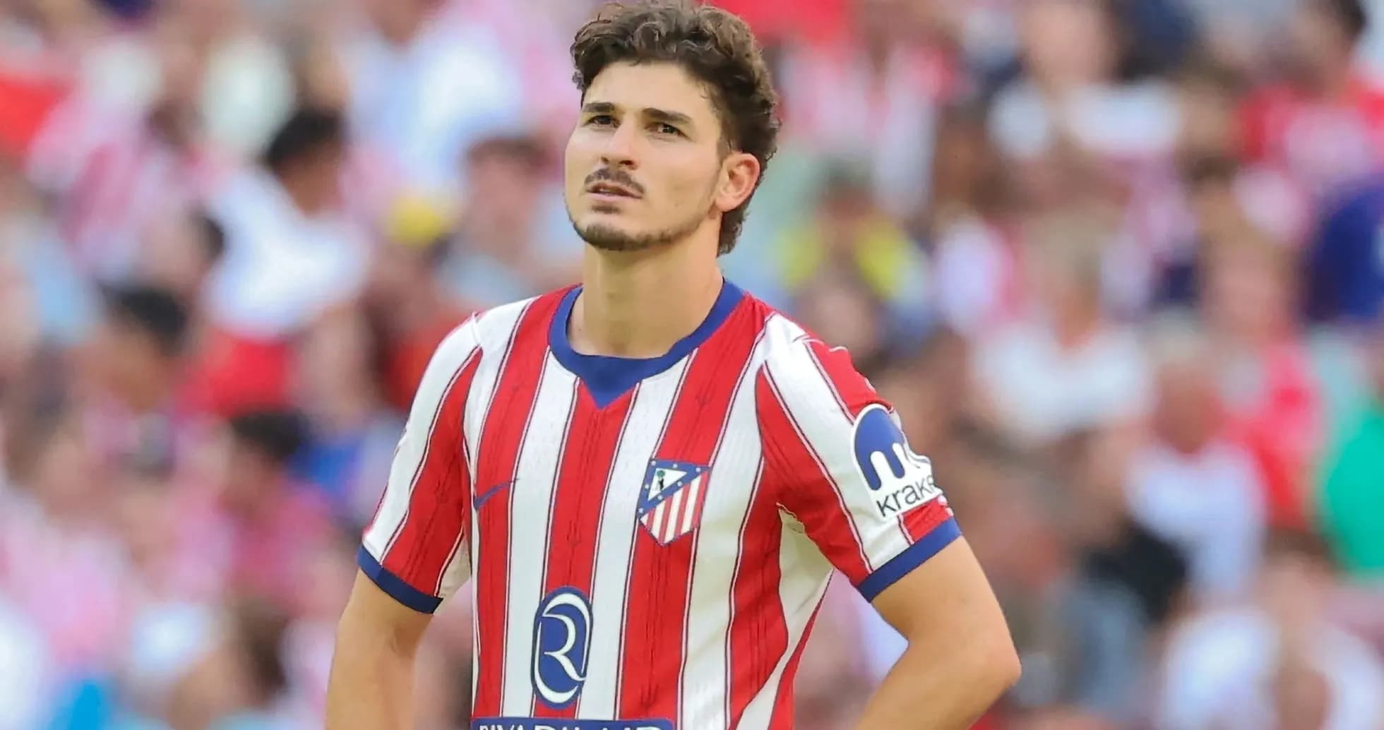 Atletico Madrid player looking up during match