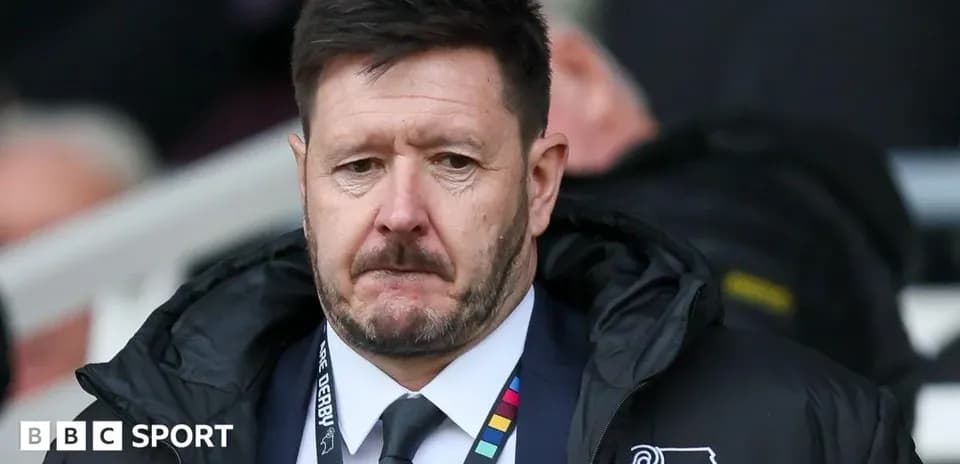 Manager observing from the sidelines during match