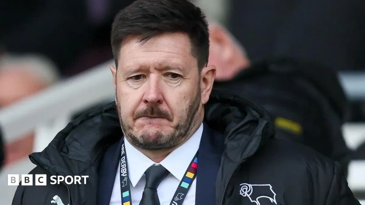 Manager observing from the sidelines during match