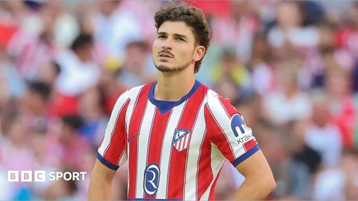 Atletico Madrid player looking concerned during match