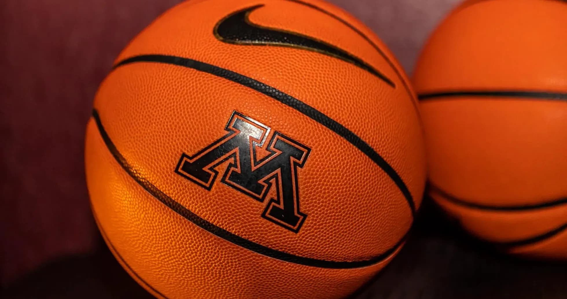 Two basketballs with Minnesota logo and Nike branding