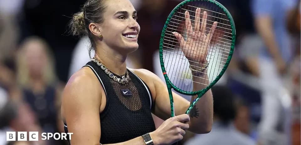 Tennis player waving after match victory