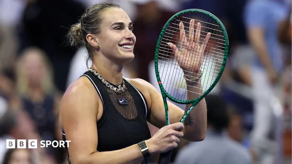 Tennis player waving after match victory