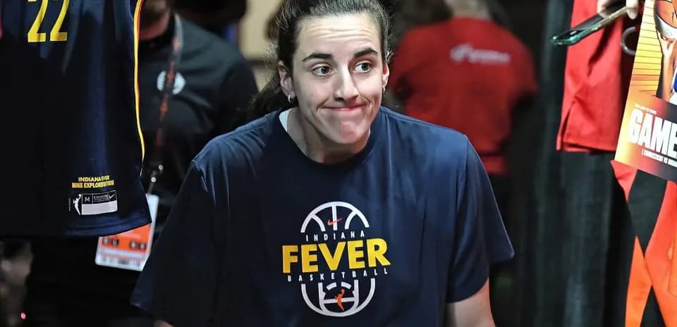 Player walking onto court wearing Indiana Fever shirt