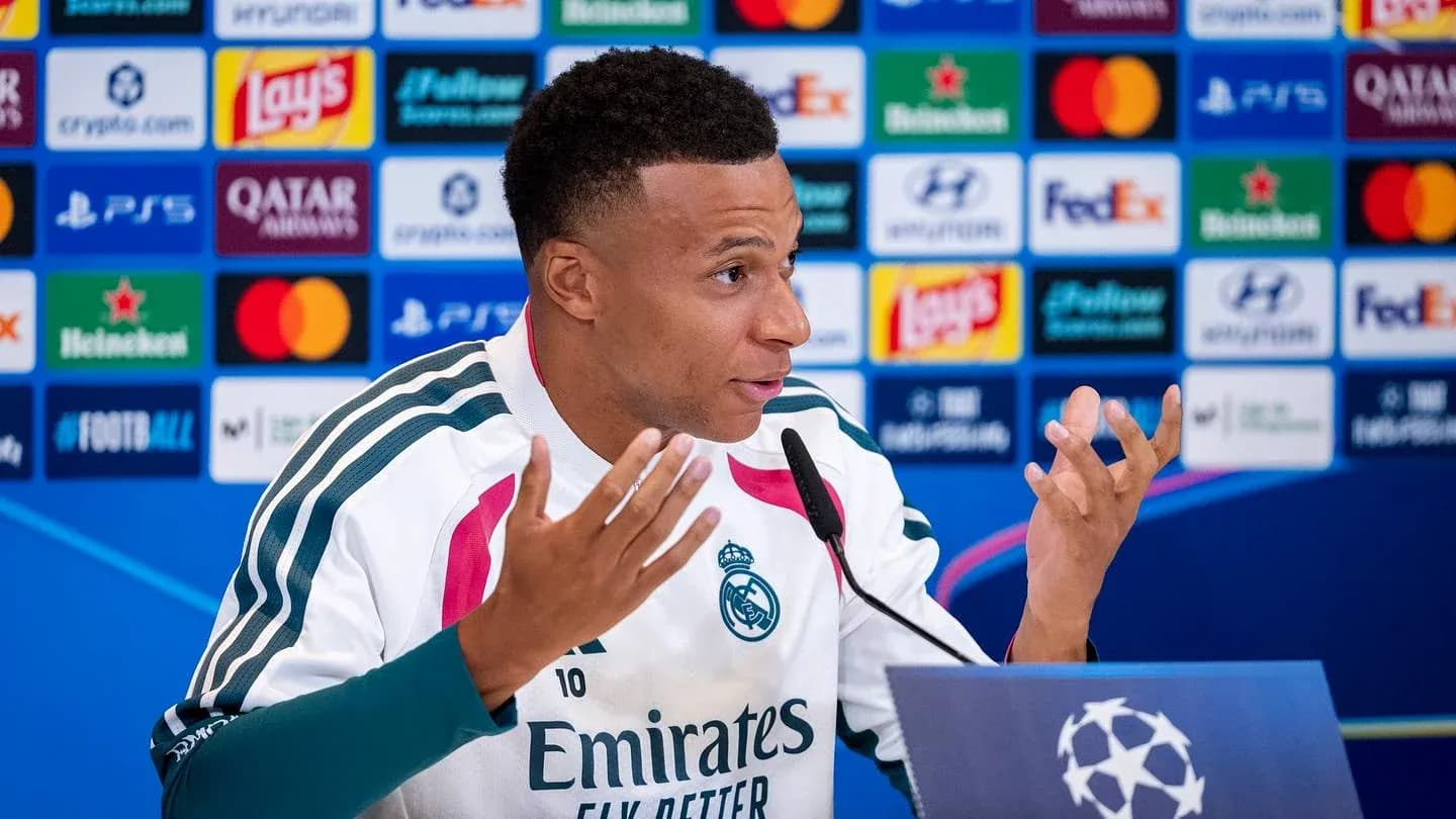 Player speaking at press conference with UEFA backdrop