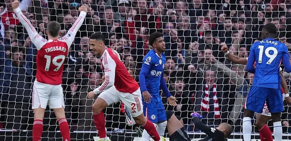Arsenal players celebrate a goal against Chelsea