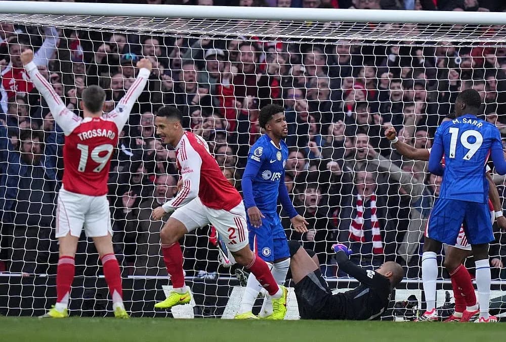 Arsenal players celebrate a goal against Chelsea