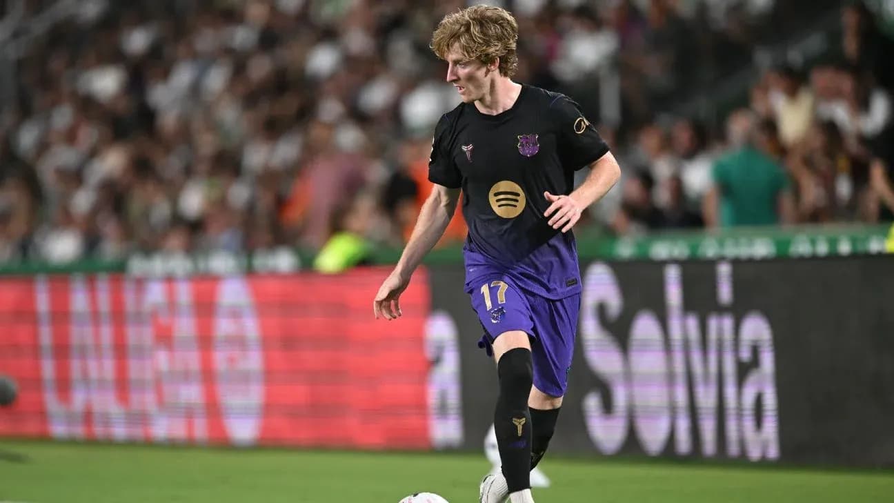 Player in Barcelona kit dribbling the ball on field