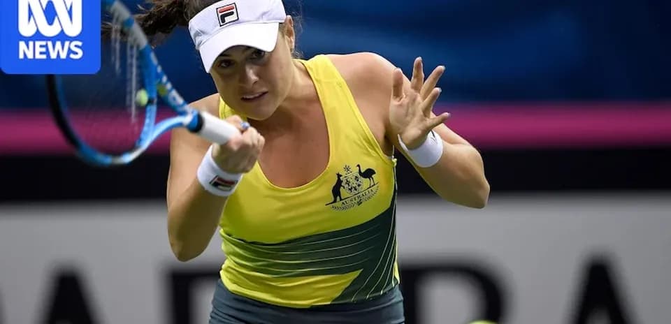 Female tennis player serving during a match