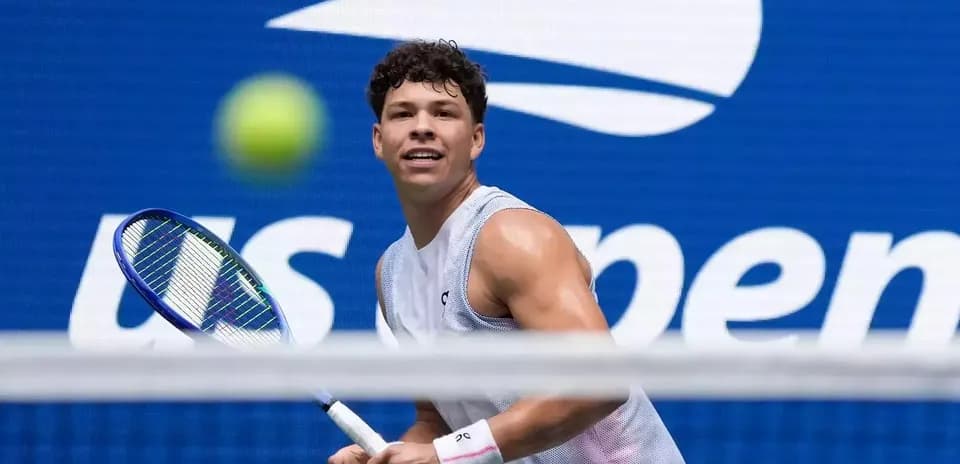 Tennis player preparing to hit a ball at US Open