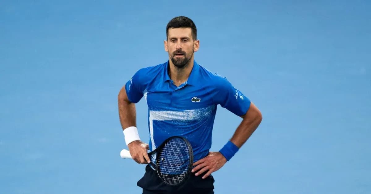 Tennis player in blue shirt on court