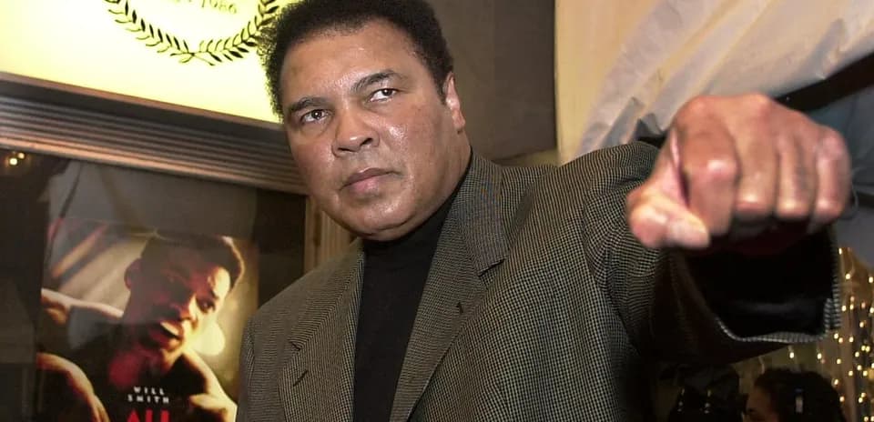 Muhammad Ali posing with a raised fist