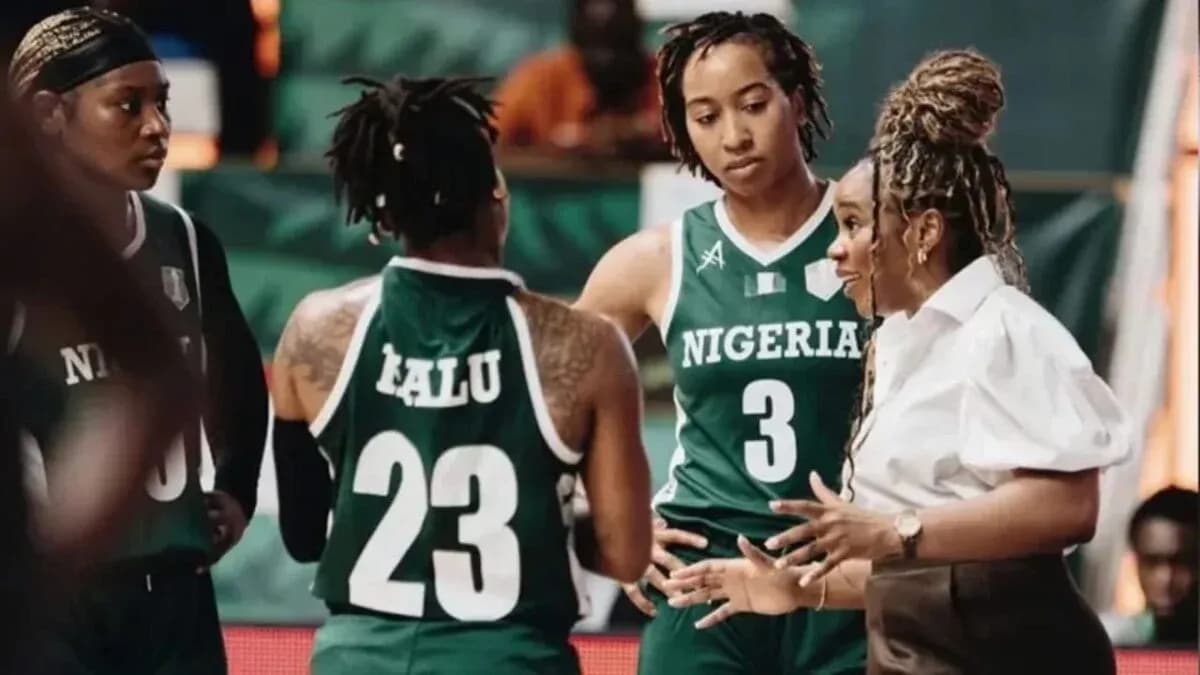 Coach discussing strategy with Nigeria women's basketball team