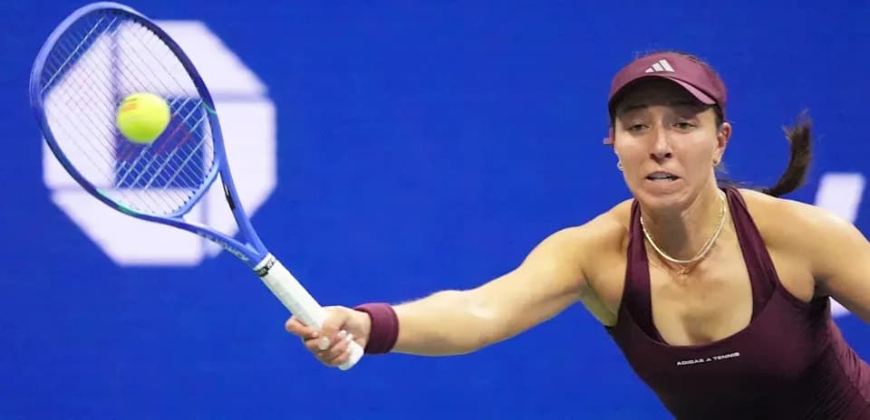 Player reaching for a tennis ball during match
