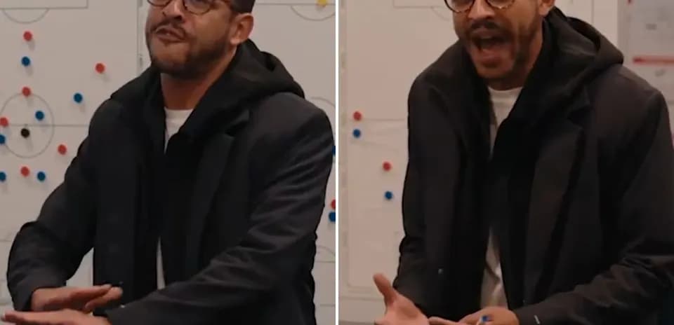 Coach explaining strategy in front of a whiteboard